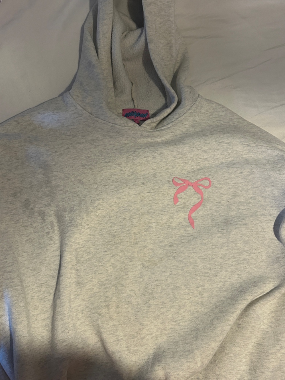 Edikted Light Gray Sweatshirt with Pink Ribbon Graphic